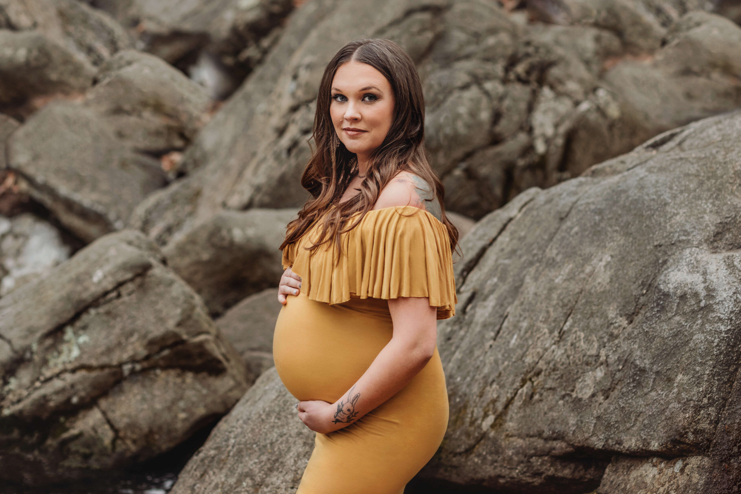 maternity and pregnancy photographer in ashburn virginia, pregnant woman posing in a beautiful mustard hand-made couture maternity gown in an outdoor park location in Great Falls, VA in the fall because maternity photo shoots are worth it.