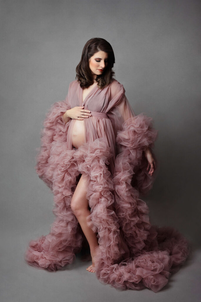 pregnant woman wearing tulle fluffy pink maternity robe at her northern virginia maternity session