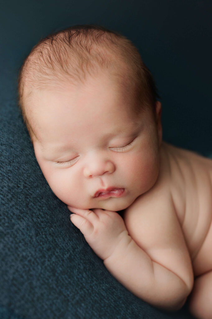 baby on a blue backdrop newborn photography dc
